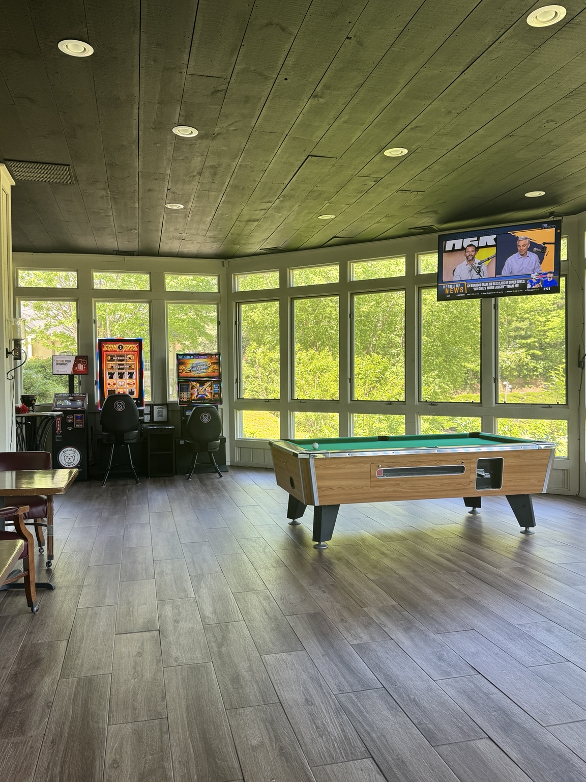 Pool table, TVs and game machines in the light-filled Embers Vine game room